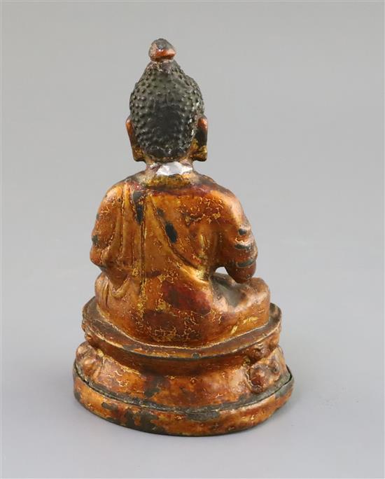 A Chinese gilt lacquered bronze figure of Buddha, 18th/19th century, H. 7.3cm, repair to neck